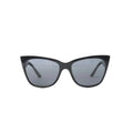 Prada SPR 23X sunglasses with black cat-eye front frame, gray tinted lenses, white side panels and black temples on white background.