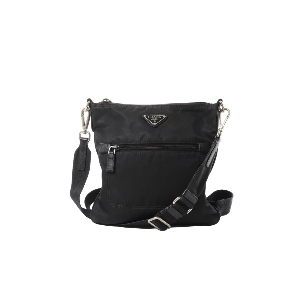 Black Prada Tessuto nylon crossbody bag with triangle logo plaque, front zip pocket, adjustable web strap and silver-tone hardware