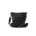 Black Prada Tessuto nylon crossbody bag with triangle logo plaque, front zip pocket, adjustable web strap and silver-tone hardware