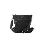 Black Prada Tessuto nylon crossbody bag with triangle logo plaque, front zip pocket, adjustable web strap and silver-tone hardware