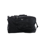 Prada Tessuto black nylon and leather 2Way travel bag with dual top handles, detachable shoulder strap, zip-top closure and signature Prada triangle logo plaque.