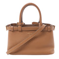 Prada small brown soft-grain leather 2-way handbag with top handles, detachable shoulder strap, buckle strap details, gold-tone hardware, and embossed Prada Milano logo on white background.