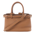 Prada small brown soft-grain leather 2-way handbag with top handles, detachable shoulder strap, buckle strap details, gold-tone hardware, and embossed Prada Milano logo on white background.
