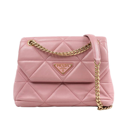 Prada Spectrum Small Shoulder Bag in pink quilted leather with gold-tone chain strap and Prada Milano triangle logo plaque on the front, displayed against a white background.
