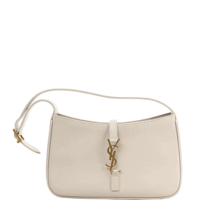 Saint Laurent Le 5 à 7 Small Shoulder Bag 657228 in white smooth leather featuring a curved silhouette, adjustable strap, and gold-tone YSL logo hardware.