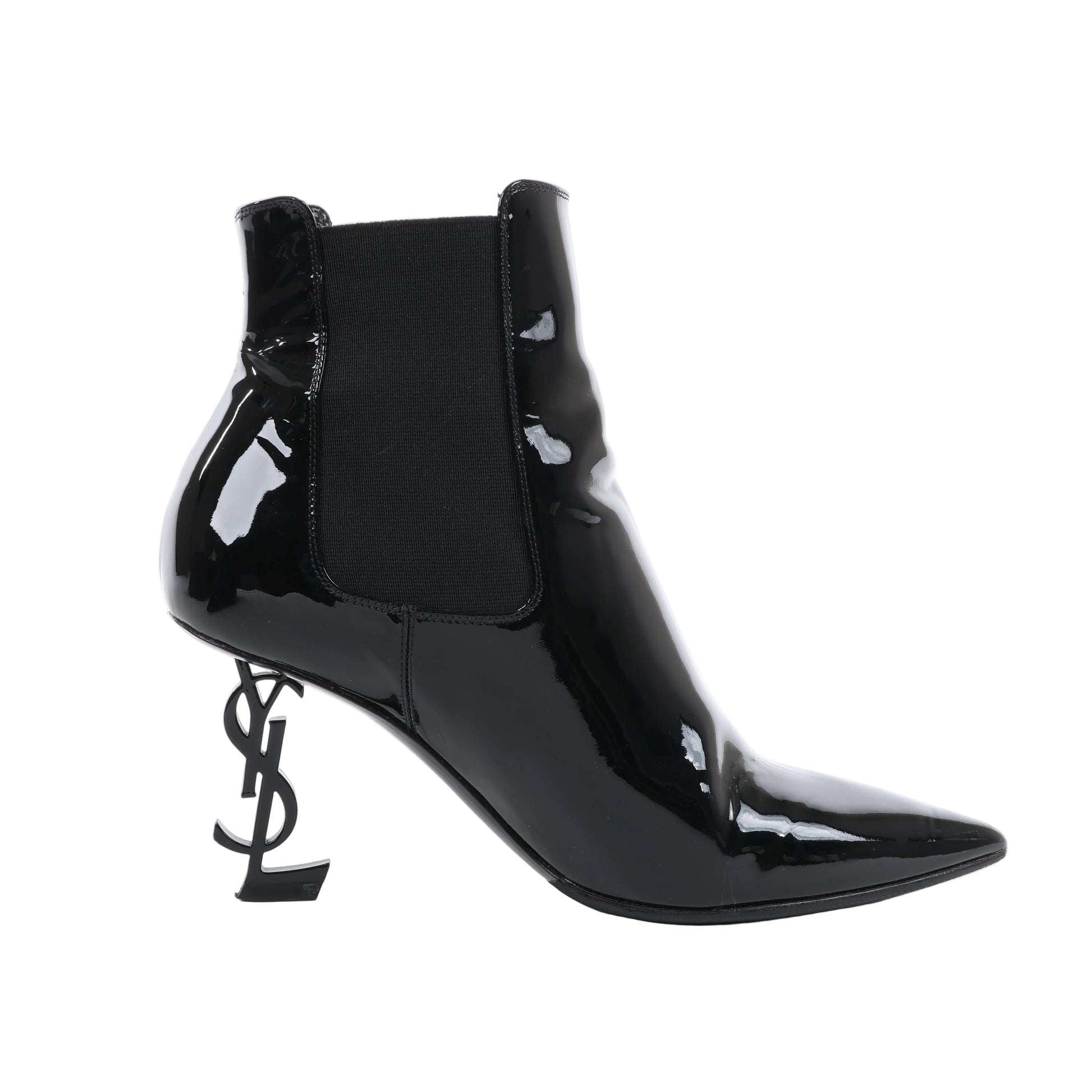 Saint Laurent Paris Opium ankle boots in black patent leather featuring pointed toe, elastic side panels, and sculptural YSL logo heel. Size 37.5 EU.