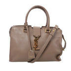 Beige Saint Laurent Baby Cabas leather handbag with twin rolled handles, a matching shoulder strap, gold-tone YSL monogram and hanging leather tag.