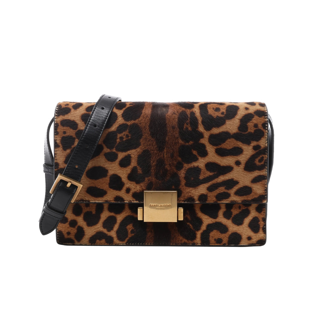 Brown and black leopard-print Saint Laurent Bellechasse bag with black leather shoulder strap and rectangular gold-tone front clasp.