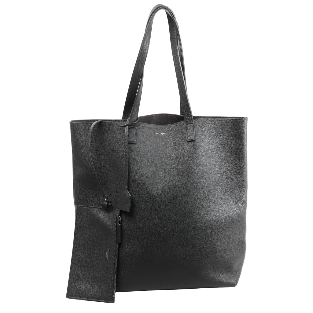 Gray Saint Laurent Bold grainy leather tote bag with long shoulder straps, small front logo and coordinating hanging zip pouch.