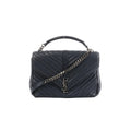 Saint Laurent College navy chevron-quilted leather handbag with top handle, silver-tone chain strap, and YSL monogram on front flap, front view on white background.