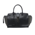 Black Saint Laurent Downtown Cabas leather handbag with silver-tone YSL logo, top handles and studded side panels.
