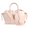 Saint Laurent Paris Downtown Cabas 2-Way handbag in light pink leather and suede with gold-tone YSL logo, top handles, and detachable shoulder strap.