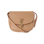 Beige Saint Laurent Kaia leather shoulder bag with curved flap, slim strap and gold-tone YSL monogram clasp.