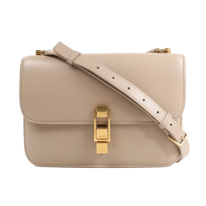 Saint Laurent Paris Carré Leather Shoulder Bag 633214 in beige calfskin, featuring a structured rectangular shape, gold-tone push-lock clasp, and adjustable shoulder strap, displayed against a white background.