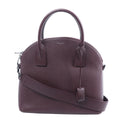 Burgundy Saint Laurent Sac de Jour leather handbag with rounded top handles, matching shoulder strap, zip closure and silver-tone hardware.