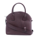 Burgundy Saint Laurent Sac de Jour leather handbag with rounded top handles, matching shoulder strap, zip closure and silver-tone hardware.