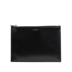 Saint Laurent Paris leather clutch in black featuring a sleek rectangular design, smooth finish, gold-tone top zip closure, and subtle “SAINT LAURENT PARIS” logo at the top center.