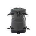 Saint Laurent Livington backpack in dark gray canvas with black leather base, adjustable webbing straps with metal buckles, top handle and front ring detail on white background.