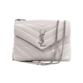 Front view of a light grey Saint Laurent Loulou bag with padded chevron quilting, an envelope flap, silver-tone YSL logo and chain shoulder strap.