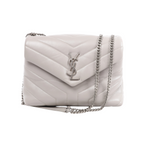 Front view of a light grey Saint Laurent Loulou bag with padded chevron quilting, an envelope flap, silver-tone YSL logo and chain shoulder strap.