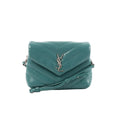 Green Saint Laurent Loulou puffer leather crossbody bag with chevron quilting, front flap, silver YSL logo, and strap on white background.