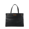 Front view of Saint Laurent Manhattan shoulder bag in black leather with double top handles, structured rectangular shape, and gold-tone strap-and-clasp detail.