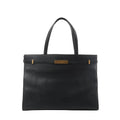 Front view of Saint Laurent Manhattan shoulder bag in black leather with double top handles, structured rectangular shape, and gold-tone strap-and-clasp detail.