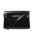 Saint Laurent Manhattan shoulder bag in black patent leather with a slim strap, structured flap and gold-tone clasp hardware.