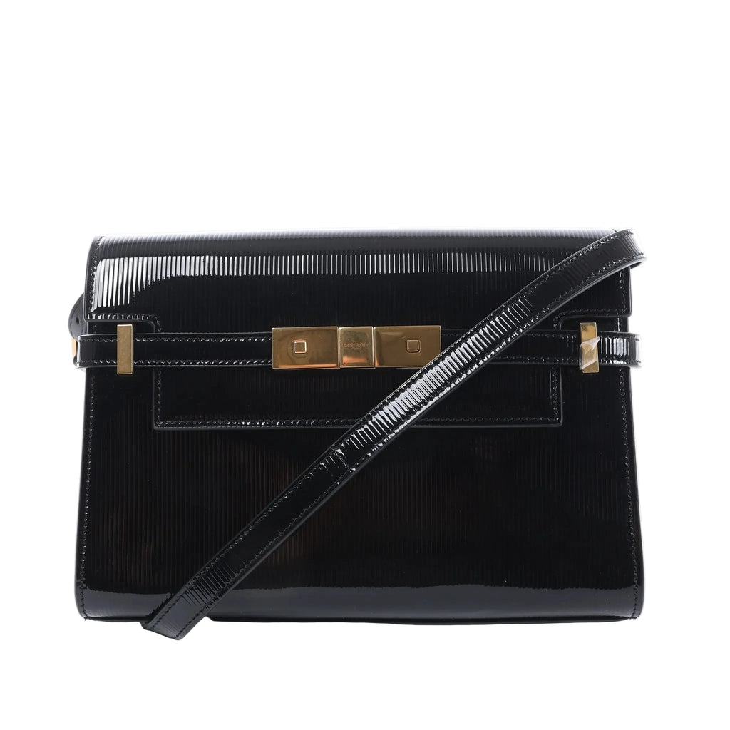 Saint Laurent Manhattan shoulder bag in black patent leather with a slim strap, structured flap and gold-tone clasp hardware.