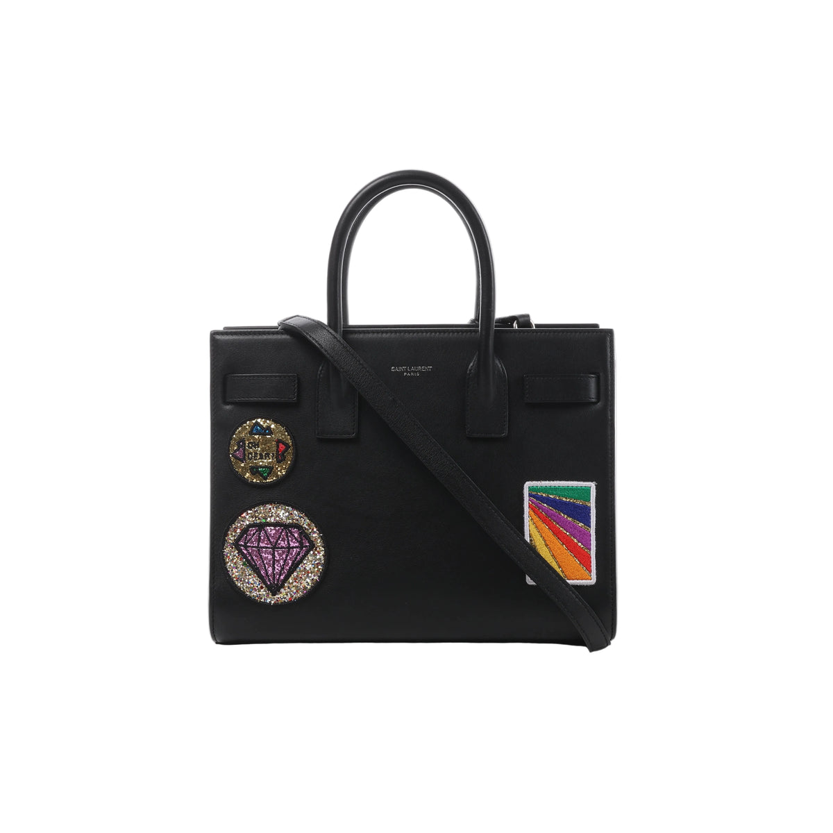 Black Saint Laurent Sac de Jour Small leather handbag with top handles, long shoulder strap and colorful decorative patches on the front.
