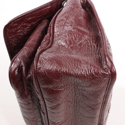 Sac à bandoulière Saint Laurent Paris Niki en cuir bordeaux avec chaîne 498894