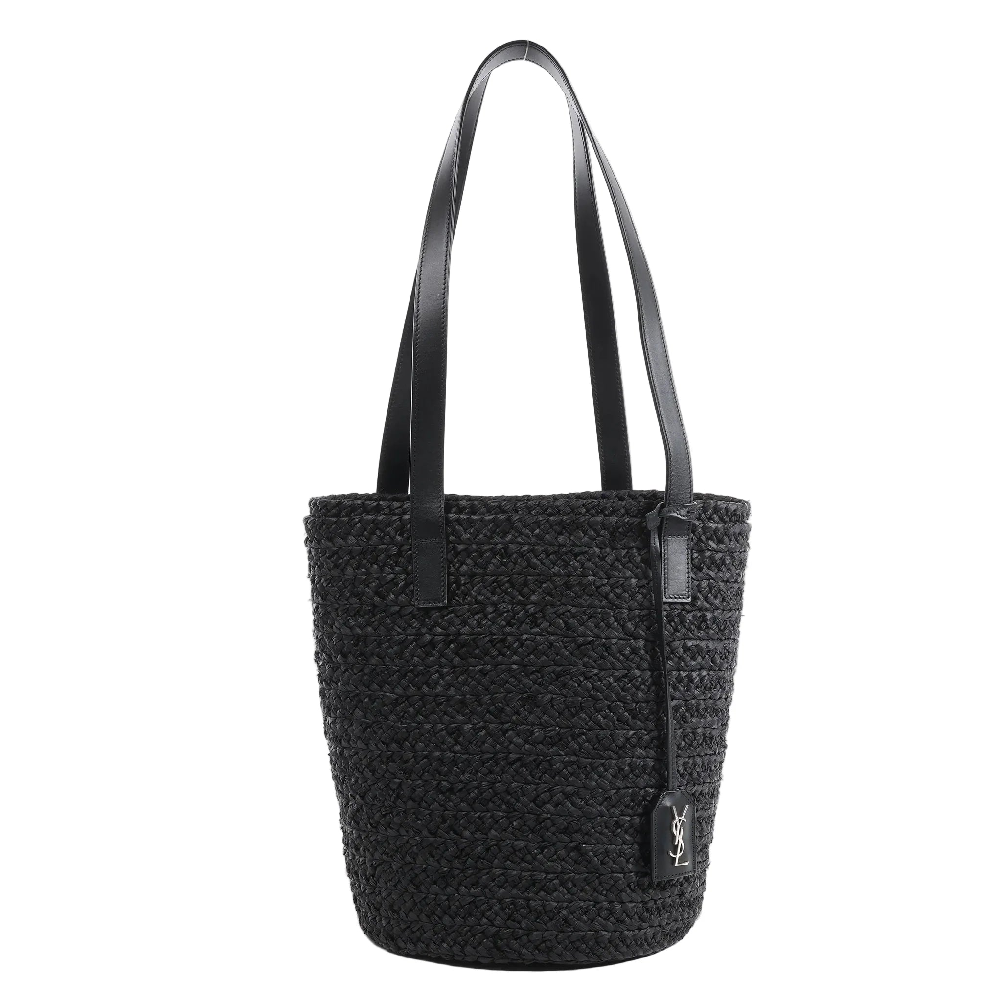 Saint Laurent Paris Panier Small Shoulder Bag in black woven raffia with black leather straps and hanging YSL logo tag, shown upright against a white background.