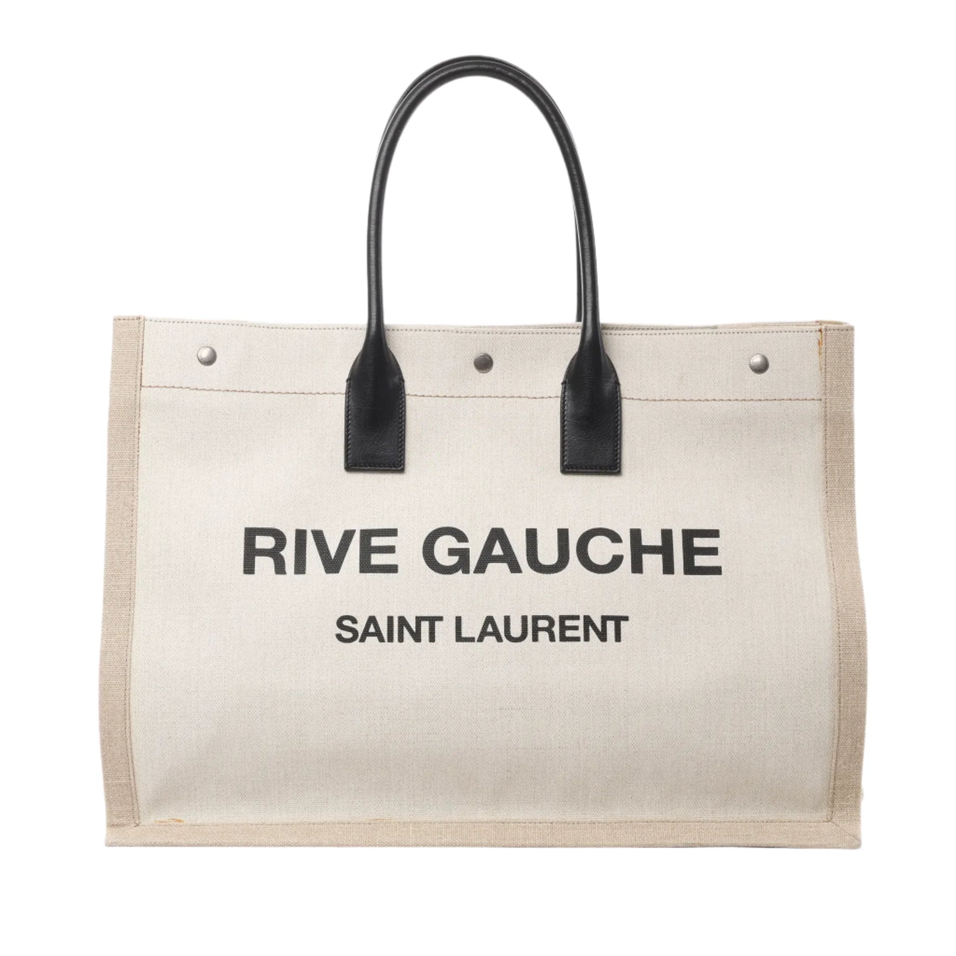 Front view of Saint Laurent Rive Gauche Large Tote Bag 499290 in beige canvas with black printed logo text, black leather top handles, and silver-tone hardware, displayed against a white background.