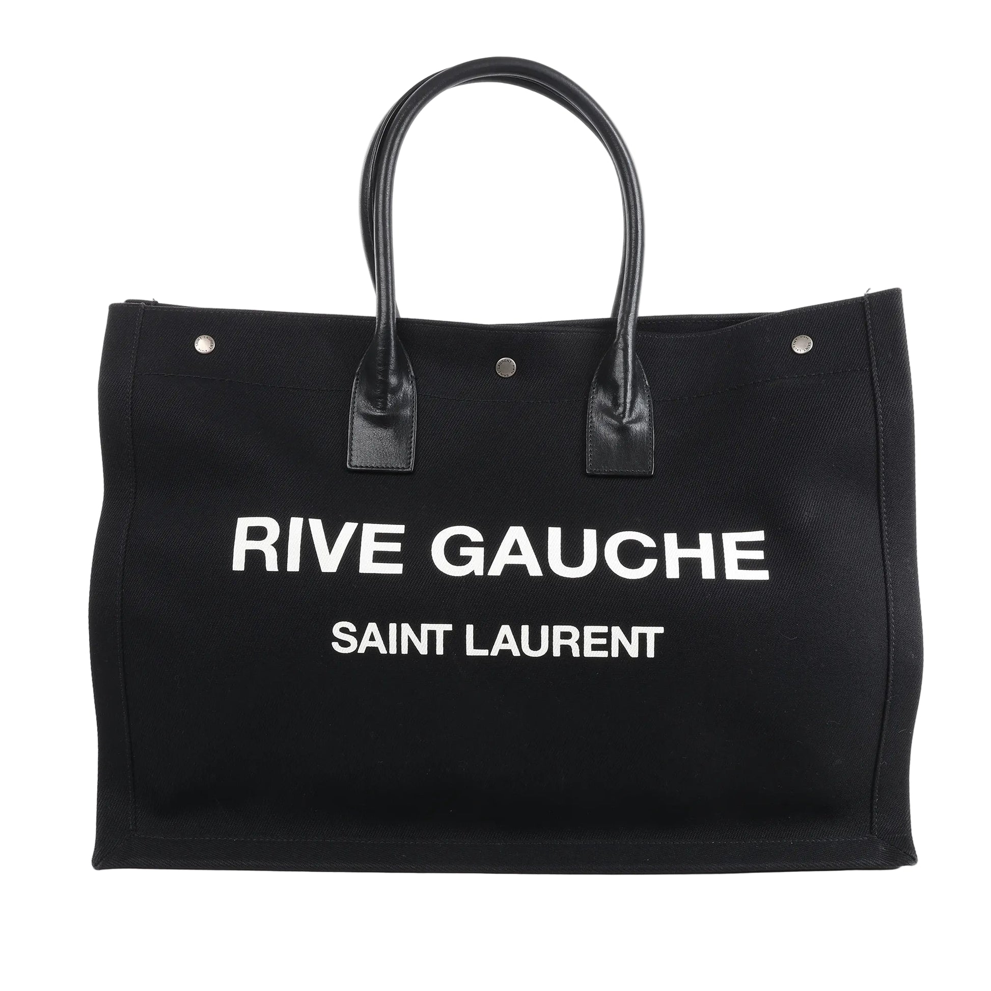 Saint Laurent Rive Gauche Large Tote Bag 509415 in black canvas with white printed logo, dual black leather handles, and structured rectangular design against a white background.