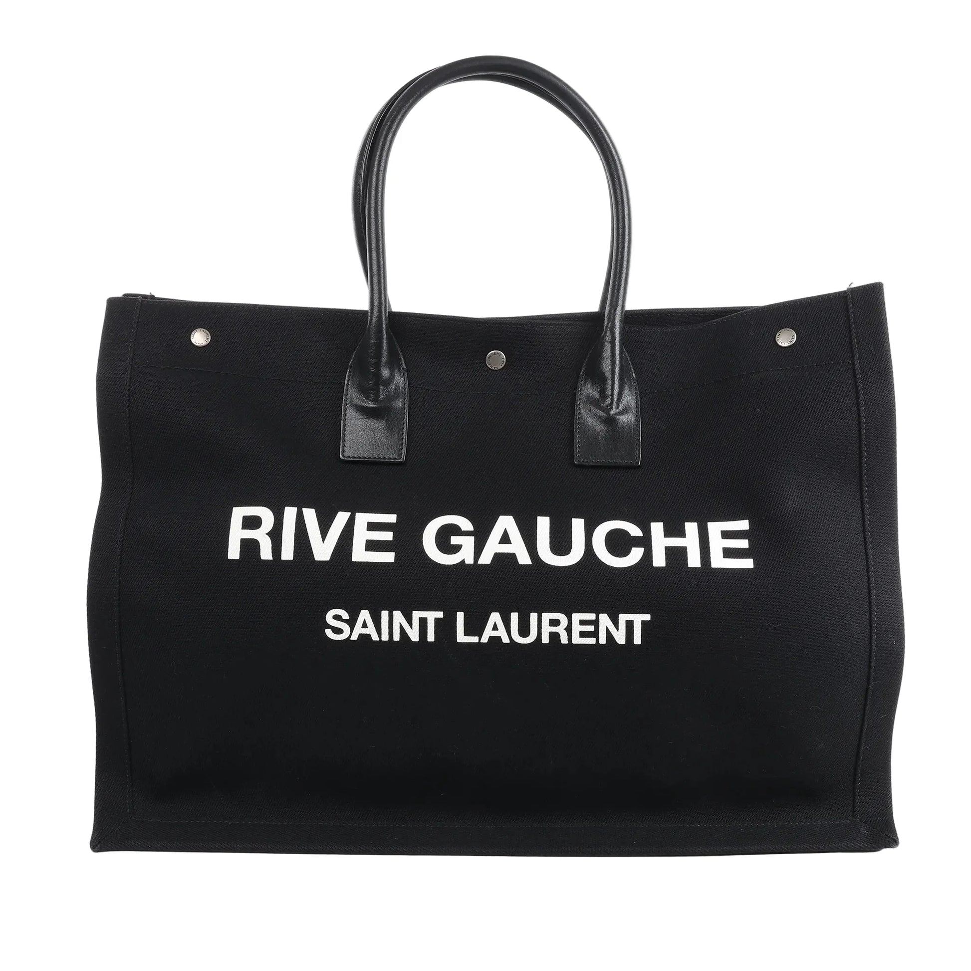 Saint Laurent Rive Gauche Large Tote Bag 509415 in black canvas with white printed logo, dual black leather handles, and structured rectangular design against a white background.