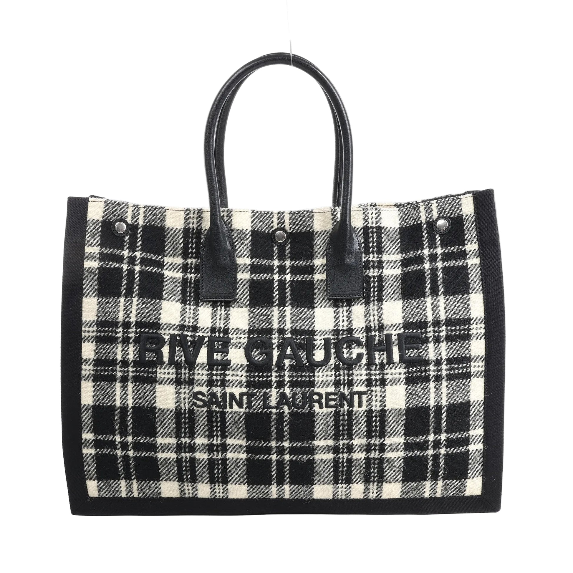 Saint Laurent Paris Rive Gauche Tote Bag 499290 in black and white plaid wool with black leather handles, front logo lettering, and structured rectangular shape against a white background.