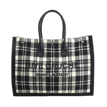 Saint Laurent Paris Rive Gauche Tote Bag 499290 in black and white plaid wool with black leather handles, front logo lettering, and structured rectangular shape against a white background.