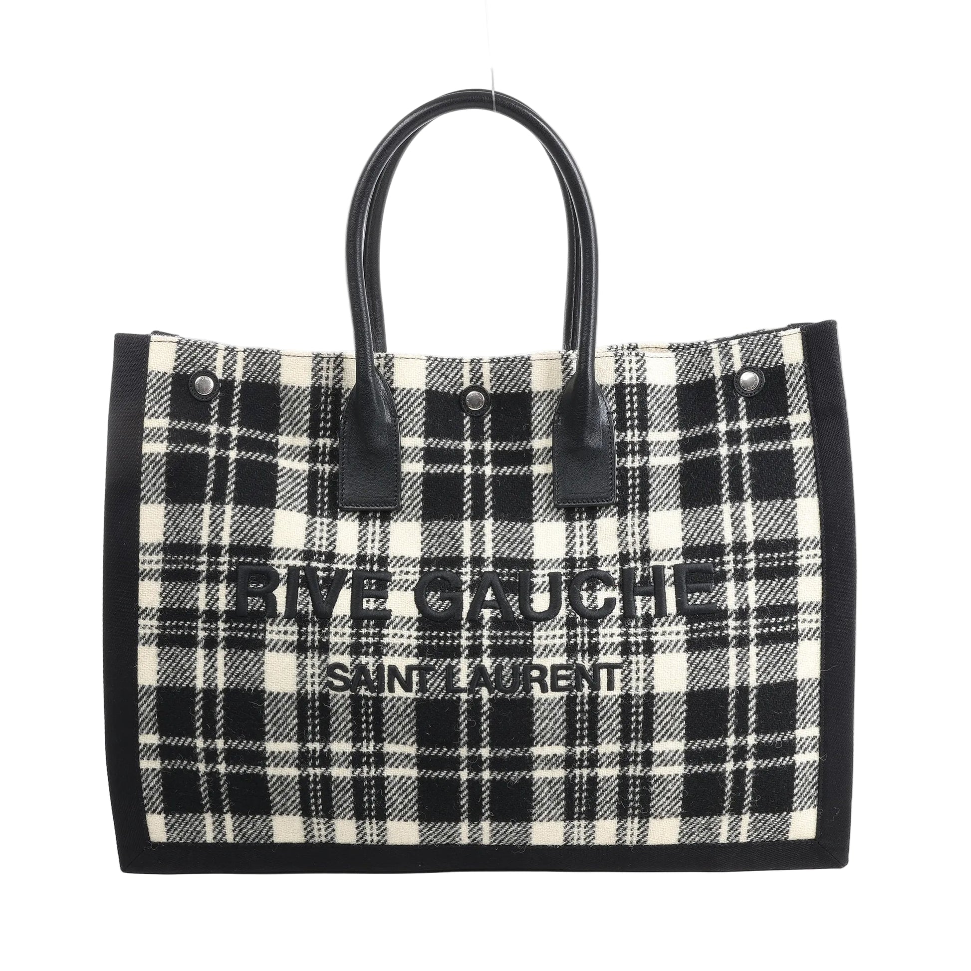 Saint Laurent Paris Rive Gauche Tote Bag 499290 in black and white plaid wool with black leather handles, front logo lettering, and structured rectangular shape against a white background.