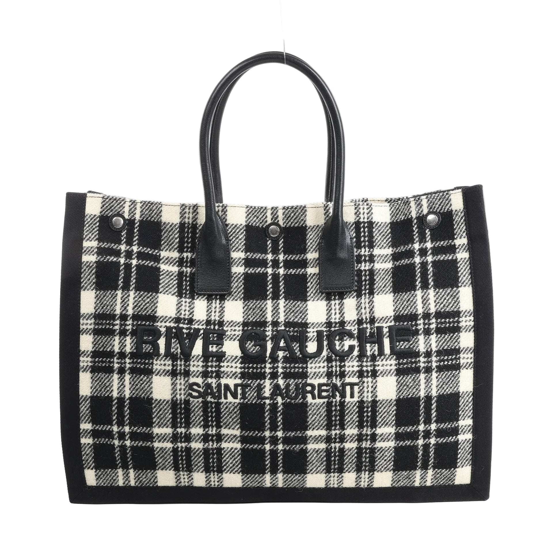 Saint Laurent Paris Rive Gauche Tote Bag 499290 in black and white plaid wool with black leather handles, front logo lettering, and structured rectangular shape against a white background.