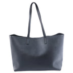 Black Saint Laurent leather tote bag with long shoulder straps, open-top silhouette and subtle gold-tone logo lettering on the front.