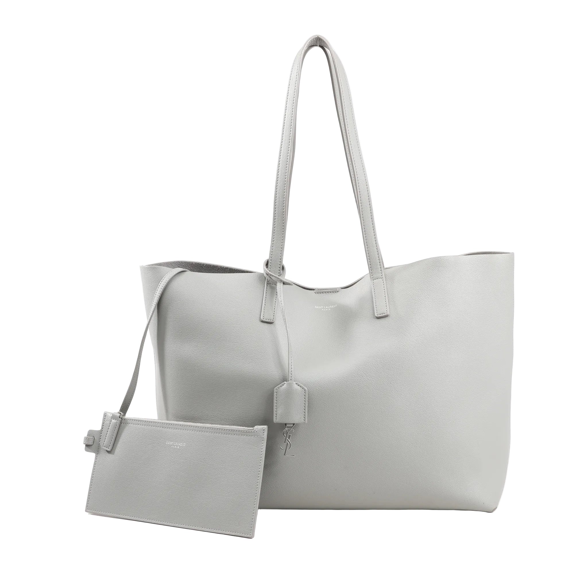 Saint Laurent Paris Shopping Tote 600281 in gray leather featuring dual thin shoulder straps, minimalist design, hanging YSL charm, and detachable zip pouch.