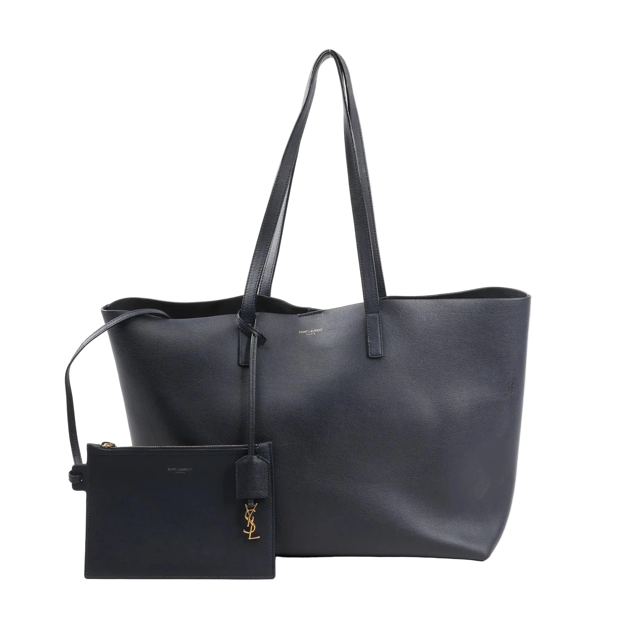 Front view of the Saint Laurent Paris Shopping Bag 394195 in navy blue leather, featuring long flat handles, minimal branding, and a matching detachable zip pouch with gold YSL charm.