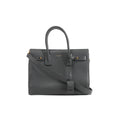 Gray Saint Laurent Sac de Jour Small grainy leather handbag with double top handles, shoulder strap, gold-tone hardware and front logo.