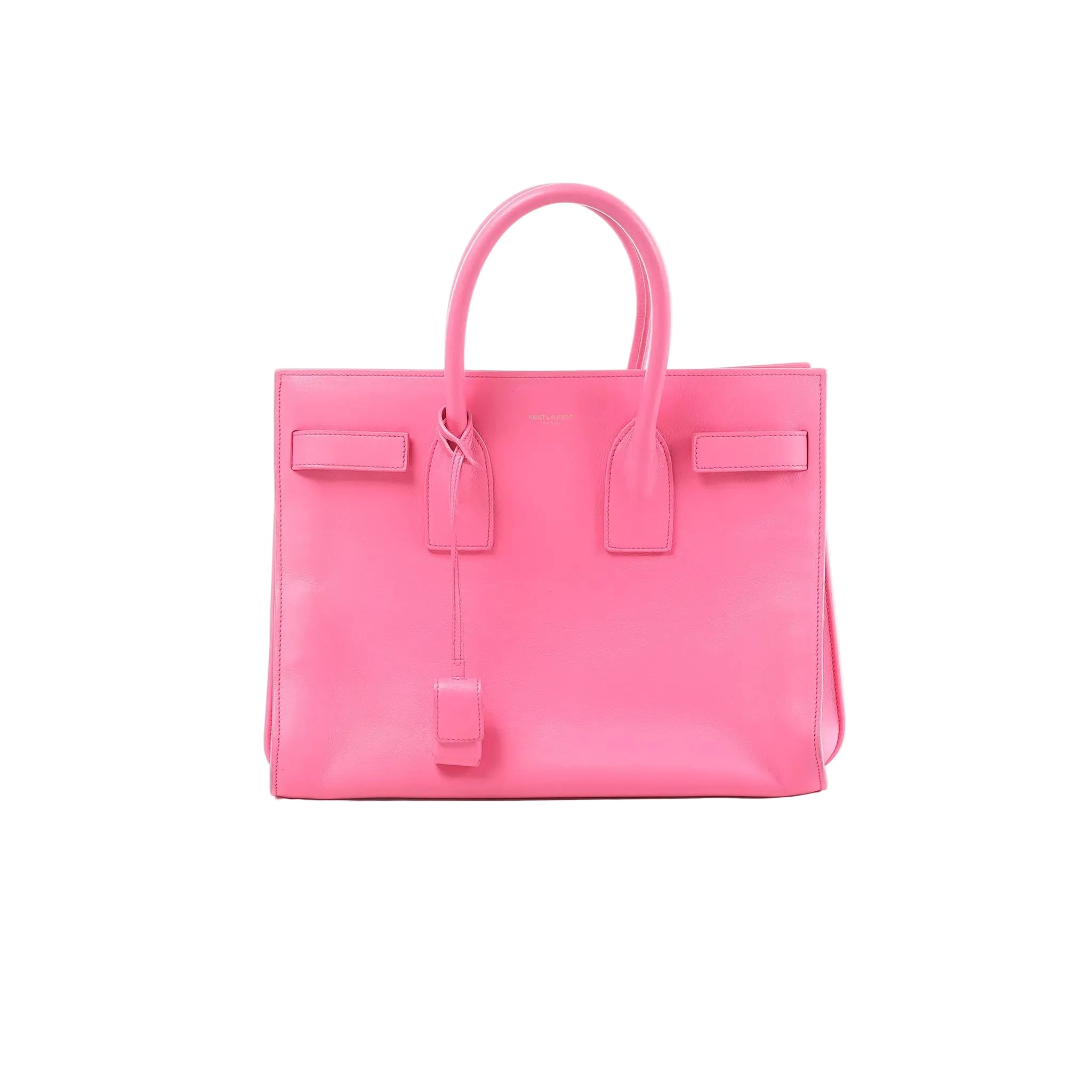 Saint Laurent Sac de Jour pink leather structured handbag with top handles, hanging clochette, and small gold logo text on front, on white background