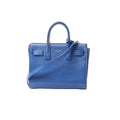 Blue Saint Laurent Paris Sac de Jour Nano leather 2-way handbag with top handles, detachable shoulder strap, and small Saint Laurent Paris logo on front, on white background.