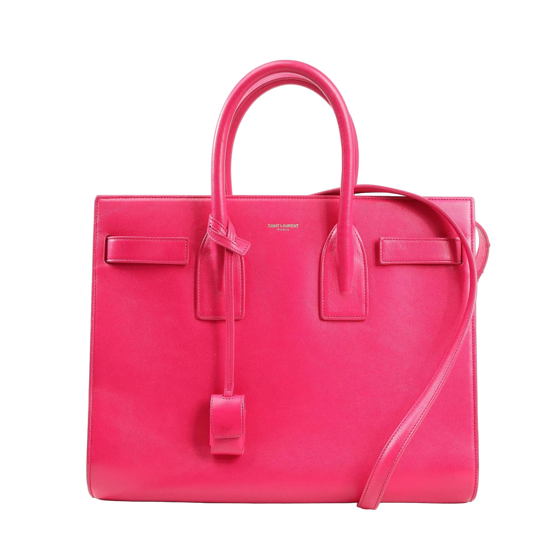 Saint Laurent Paris Sac de Jour 2-way handbag in bright pink leather featuring dual top handles, detachable shoulder strap, structured design, and gold logo stamp. Model 355153.