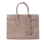 Brown Saint Laurent Sac de Jour grained leather tote bag with twin top handles, structured sides and gold-tone hardware.