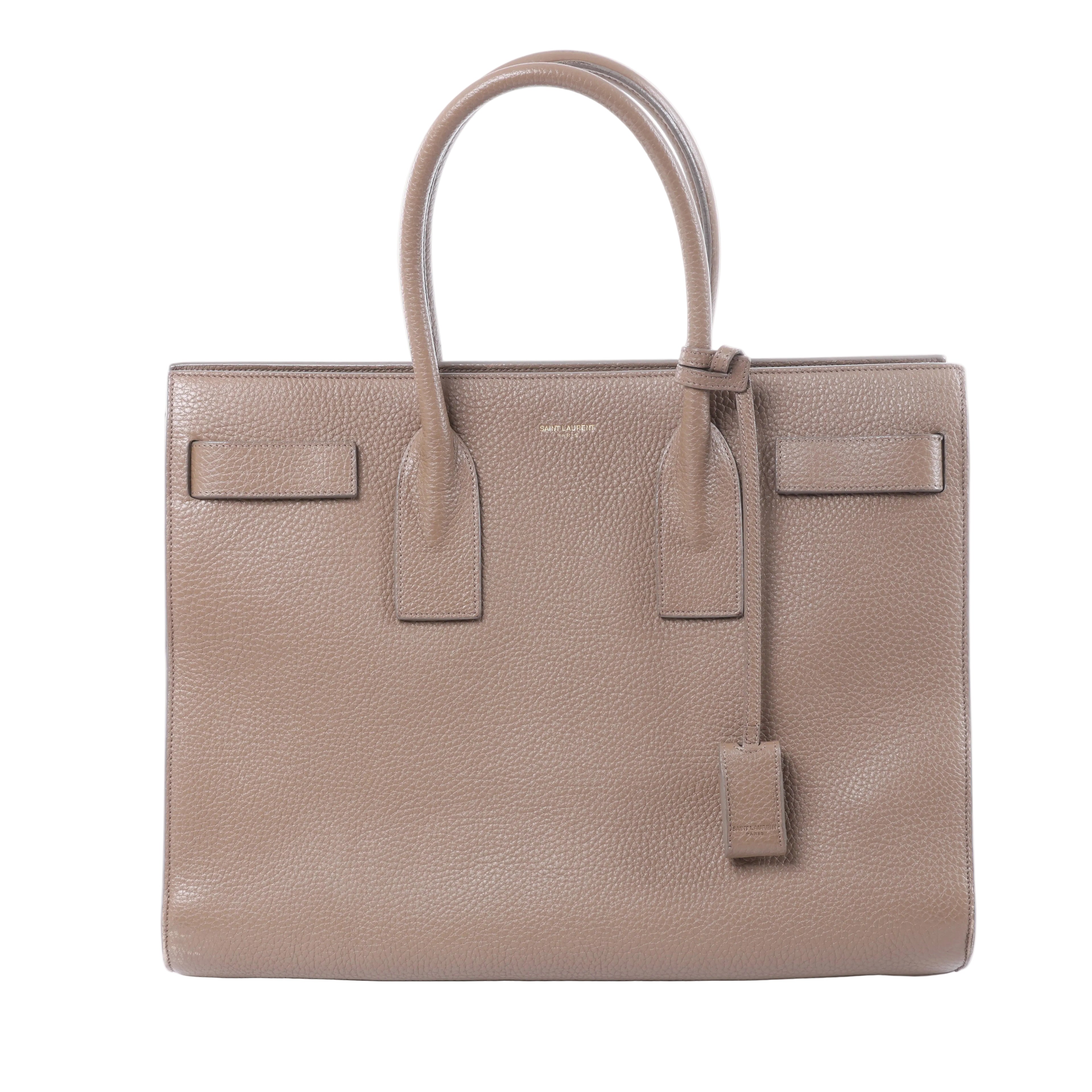Brown Saint Laurent Sac de Jour grained leather tote bag with twin top handles, structured sides and gold-tone hardware.