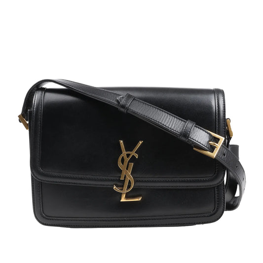 Saint Laurent Paris Solferino shoulder bag in smooth black leather featuring gold-tone YSL monogram hardware, front flap closure, and adjustable leather strap.