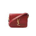 Red Saint Laurent Solferino leather crossbody bag with gold-tone YSL logo on the front and matching leather shoulder strap